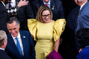 Marjorie Taylor Green models a new white dress with fur trim at the U.S. Capitol before the 2023 State of the Union address.